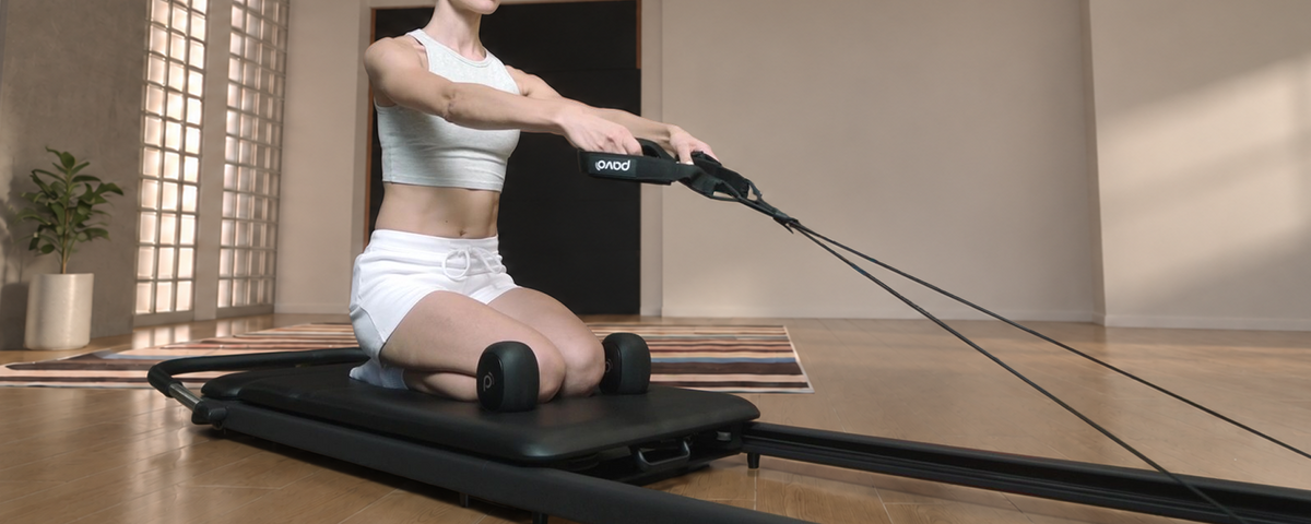 Pilates strap exercise on the PAVO Reformer