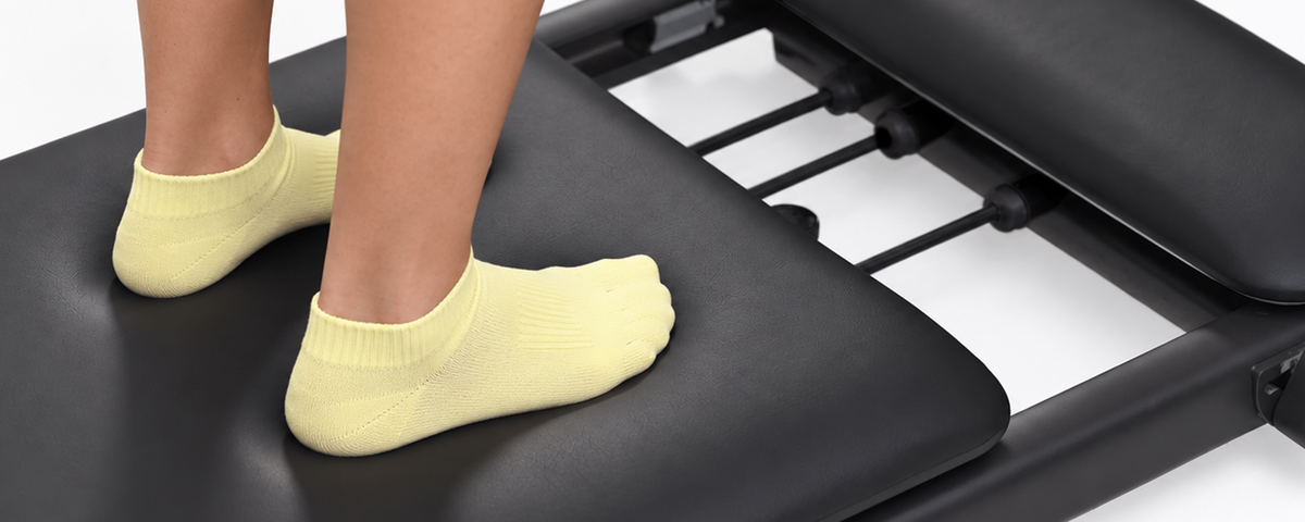 Feet resting on the PAVO Reformer carriage