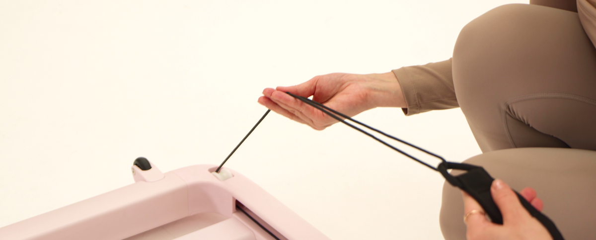Adjusting PAVO Pilates hand straps