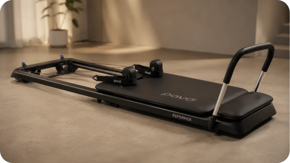 PAVO Foldable Pilates Reformer in a home workout space
